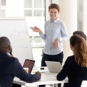 woman in meeting at whiteboard